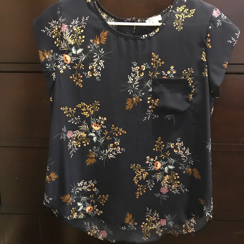 Blue floral top with pocket.